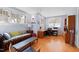 Bright and airy living room/office space featuring hardwood floors and large windows at 1714 Park Dr, Raleigh, NC 27605