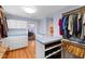 Well-organized walk-in closet with custom shelves and storage for clothing and shoes at 1714 Park Dr, Raleigh, NC 27605