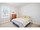 Comfortable bedroom with neutral decor, natural light, and carpeted floors at 236 Annabelle Blue Dr, Wake Forest, NC 27587