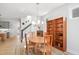 Bright dining room with a wooden table, decorative chandelier, and built-in bookshelves at 236 Annabelle Blue Dr, Wake Forest, NC 27587