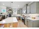 Contemporary kitchen with stainless appliances, an island with seating, and sleek countertops at 236 Annabelle Blue Dr, Wake Forest, NC 27587