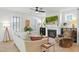 Cozy living room with a fireplace, ceiling fan, and comfortable seating at 236 Annabelle Blue Dr, Wake Forest, NC 27587