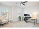 Bright home office with a white desk, ergonomic chair, and natural light from the window at 236 Annabelle Blue Dr, Wake Forest, NC 27587