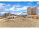 Community playground with swings, slides, and concrete tunnels under a bright blue sky with wispy clouds at 236 Annabelle Blue Dr, Wake Forest, NC 27587