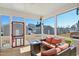 Inviting screened porch featuring comfortable seating and a view of the backyard at 236 Annabelle Blue Dr, Wake Forest, NC 27587