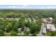 Aerial view of a neighborhood surrounded by lush greenery, showcasing a serene environment at 2409 Hodges Rd, Burlington, NC 27217