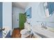 Renovated bathroom featuring a vintage sink, wainscoting, and a glass enclosed shower at 2409 Hodges Rd, Burlington, NC 27217