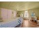 Cozy bedroom features hardwood floors, decorative desk, and pink accents at 2409 Hodges Rd, Burlington, NC 27217