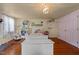 Bedroom with pink-trimmed walls, hardwood floors, and a window with light at 2409 Hodges Rd, Burlington, NC 27217
