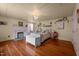 Bedroom with a fireplace, hardwood floors, and a brightly lit interior at 2409 Hodges Rd, Burlington, NC 27217