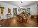 Open-concept dining area with hardwood floors and views to other rooms at 2409 Hodges Rd, Burlington, NC 27217