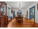 Spacious dining room featuring wood floors, a fireplace, and classic decor at 2409 Hodges Rd, Burlington, NC 27217