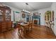 Charming dining room with hardwood floors, bright walls, decorative fireplace, and unique decor at 2409 Hodges Rd, Burlington, NC 27217