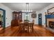 Traditional dining room with wood floors, vintage hutch, and ample natural light at 2409 Hodges Rd, Burlington, NC 27217