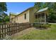 Exterior view of home with a screened porch, showcasing its backyard at 2409 Hodges Rd, Burlington, NC 27217