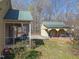 Home features screened in porch and small outbuilding at 2409 Hodges Rd, Burlington, NC 27217