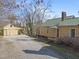 Home features detached garage and gravel driveway at 2409 Hodges Rd, Burlington, NC 27217