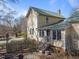 Side of house features staircase and fenced in area at 2409 Hodges Rd, Burlington, NC 27217