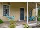 Cozy front porch with a porch swing and chairs offers a relaxing outdoor space at 2409 Hodges Rd, Burlington, NC 27217