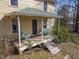 Inviting front porch with a swing and chairs, offering a relaxing outdoor space at 2409 Hodges Rd, Burlington, NC 27217