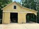 Spacious garage with ample room for storage and projects with a sliding door at 2409 Hodges Rd, Burlington, NC 27217