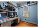 Efficient home office with natural light, built-in shelving, and wooden floors at 2409 Hodges Rd, Burlington, NC 27217