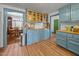 Elegant kitchen featuring blue cabinetry, wood countertops, stainless steel appliances, and stylish decor at 2409 Hodges Rd, Burlington, NC 27217