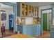 Stylish kitchen with blue cabinets, glass door storage, butcher block counters, and a pop of yellow at 2409 Hodges Rd, Burlington, NC 27217
