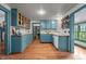 Charming kitchen with blue cabinetry, wooden countertops, and ample storage space at 2409 Hodges Rd, Burlington, NC 27217