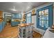Charming kitchen with blue cabinets, wood counters, an island, and a window for natural light at 2409 Hodges Rd, Burlington, NC 27217