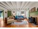 Cozy living room showcasing hardwood floors, comfortable seating, and a warm, inviting atmosphere at 2409 Hodges Rd, Burlington, NC 27217