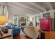 Inviting living room with hardwood floors, a fireplace, a comfortable sofa, and beamed ceilings at 2409 Hodges Rd, Burlington, NC 27217