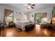 Charming main bedroom with hardwood floors, decorative plates, and a private door to the outside at 2409 Hodges Rd, Burlington, NC 27217