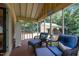 Relaxing screened porch with comfortable seating, perfect for enjoying the outdoors at 2409 Hodges Rd, Burlington, NC 27217