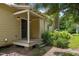 Charming side porch with ambient lighting and beautiful landscaping at 2409 Hodges Rd, Burlington, NC 27217