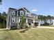 Attractive craftsman home with covered porch, two-car garage, and meticulously landscaped front yard at 266 Golfview Ave, Benson, NC 27504