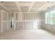 Spacious unfinished room with natural light from multiple windows, ready for personalization at 266 Golfview Ave, Benson, NC 27504