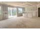 Bright, unfinished interior with sliding glass doors, ready for customization and personalization at 266 Golfview Ave, Benson, NC 27504