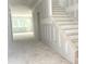 Unfinished interior showcasing a staircase and an open-concept layout with natural light at 266 Golfview Ave, Benson, NC 27504