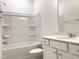 Well-lit full bathroom features tub-shower combination and granite vanity at 283 Golfview Avenue, Benson, NC 27504