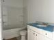Clean bathroom with a shower-tub combo and a single vanity with modern fixtures at 283 Golfview Avenue, Benson, NC 27504
