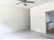 Bedroom leading to a bathroom, offering comfort with ceiling fan and ample light at 283 Golfview Avenue, Benson, NC 27504