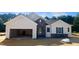 Charming single-Gathering home with stone accents, an attached garage, and classic architectural details at 283 Golfview Avenue, Benson, NC 27504
