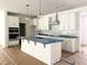 Spacious kitchen with stainless steel appliances, a center island and white cabinets at 283 Golfview Avenue, Benson, NC 27504