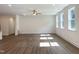 Spacious living room with wood flooring, large windows, and plenty of natural light at 283 Golfview Avenue, Benson, NC 27504