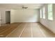 Large living room with ceiling fan offers a flexible space for entertaining and relaxation at 283 Golfview Avenue, Benson, NC 27504
