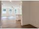 Bright, open-concept living space with luxury vinyl flooring, large windows, and modern finishes at 283 Golfview Avenue, Benson, NC 27504