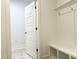 A well-lit mudroom has a bench, cubbies, and hooks, creating an inviting space at 283 Golfview Avenue, Benson, NC 27504