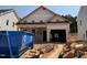 New construction home showing the unfinished exterior and two car garage on a sunny day at 346 Bluejay St, Clayton, NC 27520