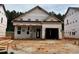 New construction home featuring an attached garage and a landscaped yard still in progress at 346 Bluejay St, Clayton, NC 27520
